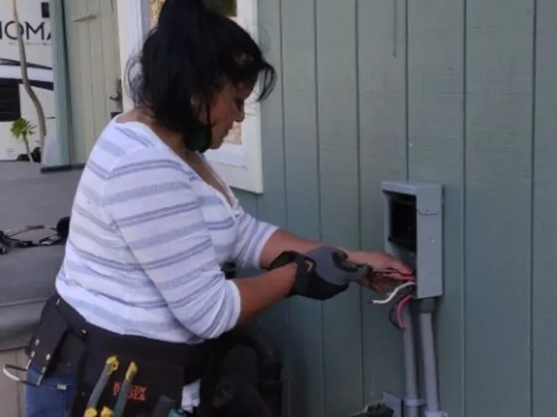 Licensed electrician wiring an exterior subpanel in Felida