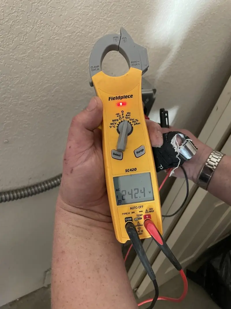 Voltage testing with clamp meter during Electrical Installation Services in Felida